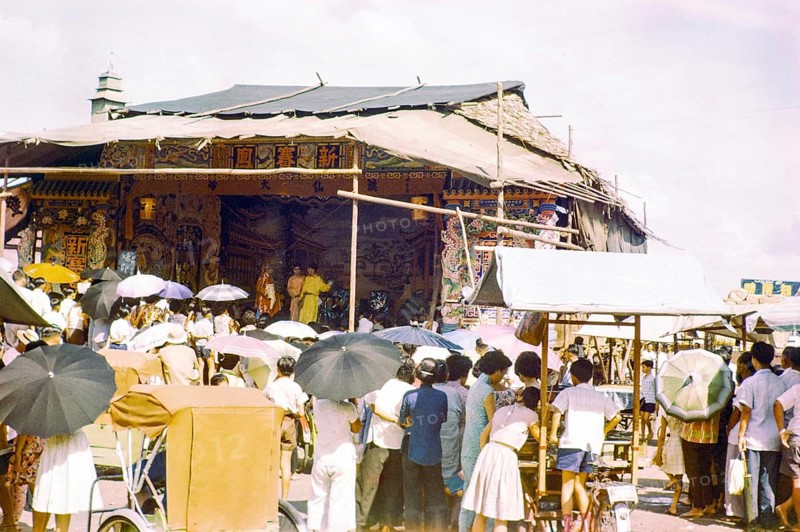 Audience watching Chinese theatre performance at the old market, Johor Bahru, Johor, Malaya, Malaysia, south east Asia 1963