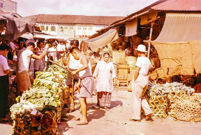 Porters with vegetables people shopping at the old market, Johor Bahru, Johor, Malaya, Malaysia, south east Asia 1963