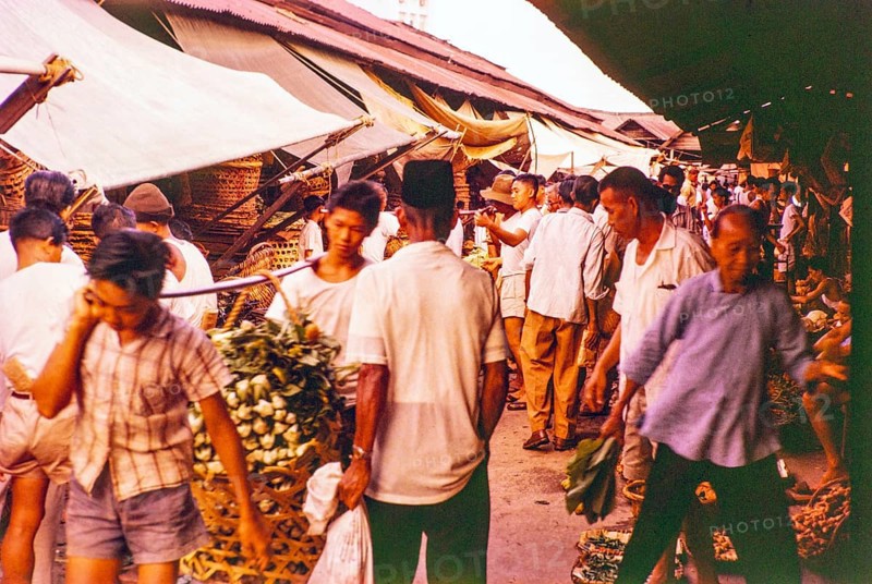 Porters with vegetables people shopping at the old market, Johor Bahru, Johor, Malaya, Malaysia, south east Asia 1963
