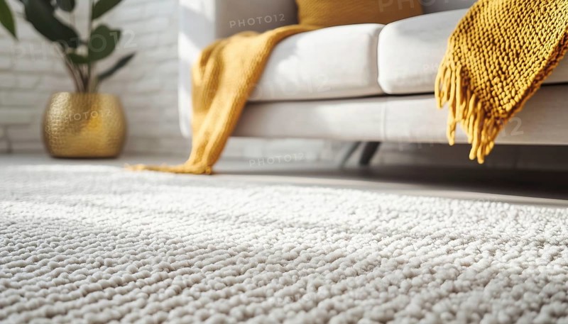 Close-Up Of Carpet And Modern Sofa With Gold Object, Pillow, Blanket, And White Brick Wall As Background. Detailed Interior Decor, AI generated