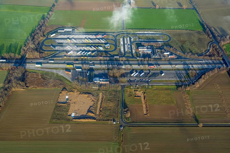 Aerial view, construction site and expansion of the motorway service area Am Haarstrang of the A44 in the district Westbüderich in Werl, Sauerland, North Rhine-Westphalia, Germany, motorway A44, DE, Europe, shapes and colours, aerial view, aerial photography, aerial photography, fog, rest area, service area, overview, bird's eye view, Werl, clouds, birds-eyes view, overview