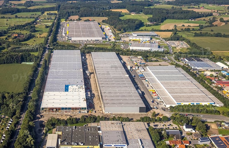 Large warehouses in an industrial area, framed by fields and scattered trees, aerial view Werl overview, Amazon distribution centre Werne, Werne, North Rhine-Westphalia, Germany