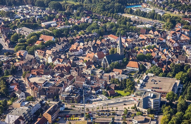 Close-up of the town centre with a prominent church surrounded by houses and green areas, aerial view Werl overview, Amazon distribution centre Werne, Werne, North Rhine-Westphalia, Germany