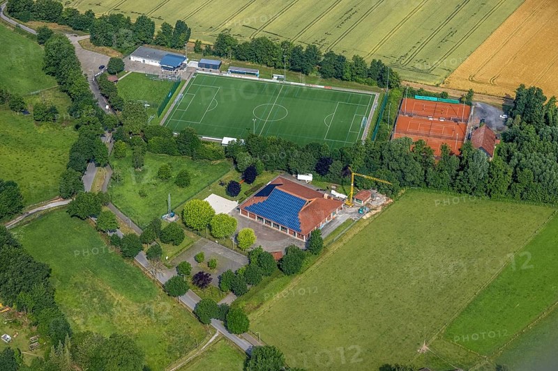 Aerial view, sports ground DJK - Blau Weiß Büderich, Kuniberthalle Büderich Schützenhalle with solar roof, Westbüderich, Werl, Soester Börde, North Rhine-Westphalia, Germany, DE, Europe, football pitch, football stadium, aerial view, aerial photography, aerial photography, photovoltaics, photovoltaic system, shooting hall, solar, solar system, solar roof, solar energy, solar energy, sports, sports facilities, sports field, sports facility, tennis, tennis facility, tennis courts, overview, venue, event location, bird's-eye view, birds-eyes view, overview