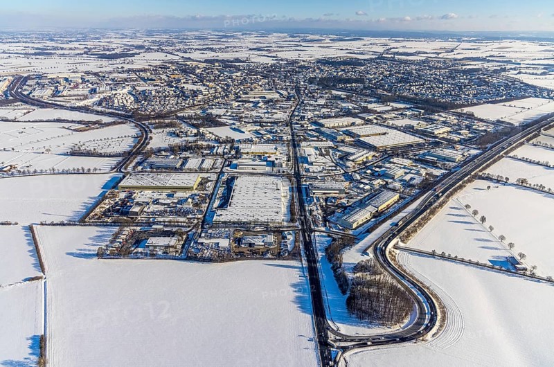 Aerial view, motorway access to the A445 motorway on the B63 Hammer Landstraße federal road, industrial area, commercial area, snow, winter, Budberg, Werl, Soester Börde, North Rhine-Westphalia, Germany, Soester, Börde, DE, Europe, birds-eyes, view, aerial photograph, aerial photography, aerial photography, overview, overview, bird's eye view, A445, B63, industry, commerce, economy, commercial enterprise, production, trade, manufacturing, transport, traffic, infrastructure, logistics, road traffic