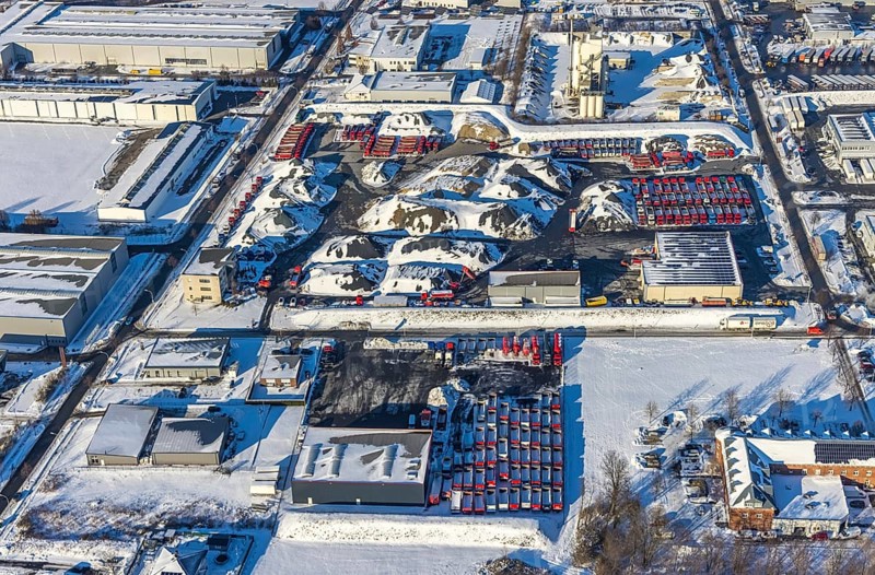 Aerial view, industrial estate KonWerl, winter, snow, Mimberg Spedition-Baustoffe GmbH & Co. KG, red lorry with loading area, Werl, Soester Börde, North Rhine-Westphalia, Germany, Soester, Börde, DE, Europe, birds-eyes, view, aerial view, aerial photography, aerial photography, overview, overview, bird's eye view, KonWerl, industry, trade, economy, commercial enterprise, production, trade