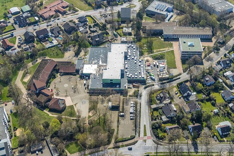 Aerial view, construction site roof renovation and remodelling of the Comenius comprehensive school, Voerde, Ruhr area, Lower Rhine, North Rhine-Westphalia, Germany, construction work, construction project, construction site, DE, Europe, aerial view, aerial photography, aerial photography, renovation, refurbishment, overview, bird's-eye view, overview