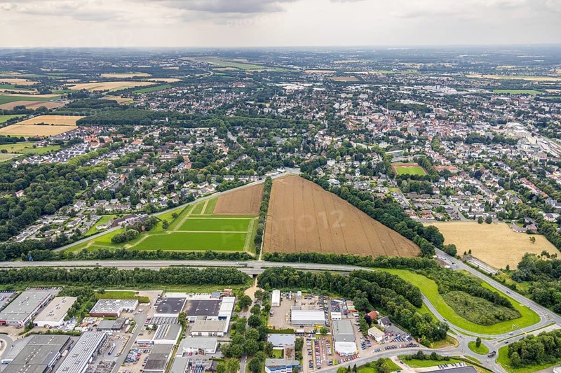 Aerial view, planned photovoltaic area Max-Planck-Straße at the industrial park Unna at the motorway A44, Unna, Ruhr area, North Rhine-Westphalia, Germany, DE, Europe, distant view, shapes and colours, aerial view, aerial photography, aerial photography, photovoltaics, photovoltaic plant, solar, solar plant, solar roof, solar energy, solar park, overview, bird's eye view, meadows and fields, birds-eyes view, overview
