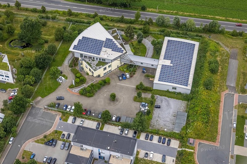 Aerial view, company building PVS / Westfalen-Süd rkV medical billing, Ülzen, Unna, Ruhr area, North Rhine-Westphalia, Germany, DE, Europe, shapes and colours, commercial enterprises, commercial area, commercial park, commercial location, commercial use, industrial area, industrial location, aerial view, aerial photography, aerial photography, photovoltaics, photovoltaic system, solar, solar system, solar roof, solar energy, solar energy, overview, bird's eye view, birds-eyes view, overview