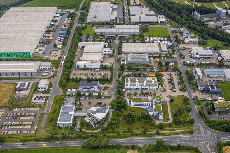 Aerial view, company building PVS / Westfalen-Süd rkV medical billing, Stadtwerke Unna, commercial area Physikerstraßen, Ülzen, Unna, Ruhr area, North Rhine-Westphalia, Germany, DE, Europe, shapes and colours, commercial enterprises, commercial area, commercial park, commercial location, commercial use, industrial area, industrial location, aerial view, aerial photography, aerial photography, photovoltaic, photovoltaic system, solar, solar system, solar roof, solar energy, solar energy, overview, bird's-eye view, birds-eyes view, overview