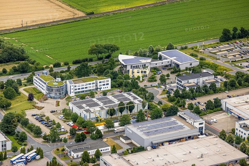 Aerial view, company building PVS / Westfalen-Süd rkV medical billing, Stadtwerke Unna, Ülzen, Unna, Ruhr area, North Rhine-Westphalia, Germany, DE, Europe, shapes and colours, commercial enterprises, commercial area, commercial park, commercial location, commercial use, industrial area, industrial site, aerial view, aerial photography, aerial photography, photovoltaic, photovoltaic plant, solar, solar plant, solar roof, solar energy, solar energy, overview, bird's-eye view, birds-eyes view, overview