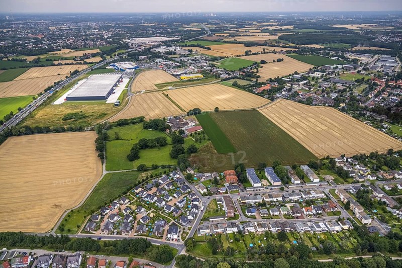 Aerial view, new Woolworth headquarters and logistics centre, IKEA furniture store Kamen, Deutsche Post DHL Logistik, commercial area Unna Kamen, housing estate Adlerweg, Afferde, Unna, Ruhr area, North Rhine-Westphalia, Germany, DE, single-family houses, Europe, commercial enterprises, commercial area, commercial park, commercial location, commercial use, property tax, real estate, industrial area, industrial building, industrial location, logistics, logistics service, logistics service provider, logistics provider, logistics centre, aerial view, aerial photography, aerial photography, overview, bird's-eye view, residential area, residential area, residential buildings, residential quality, residential quarter, housing estate, birds-eyes view, overview