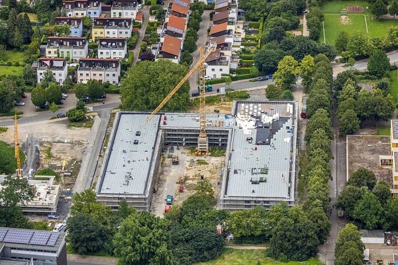 Aerial view, construction site and new building Bildungscampus Unna, new building kindergarten Rasselbande II Döbelner Straße, Königsborn, Unna, Ruhr area, North Rhine-Westphalia, Germany, construction work, construction area, construction site, building plots, construction crane, construction measure, construction project, construction site, education, campus, DE, Europe, kindergarten, day-care centre, day-care centre, day-care centre, aerial view, aerial photography, aerial photography, new building, overview, bird's-eye view, formerly Anne-Frank-Realschule, overview
