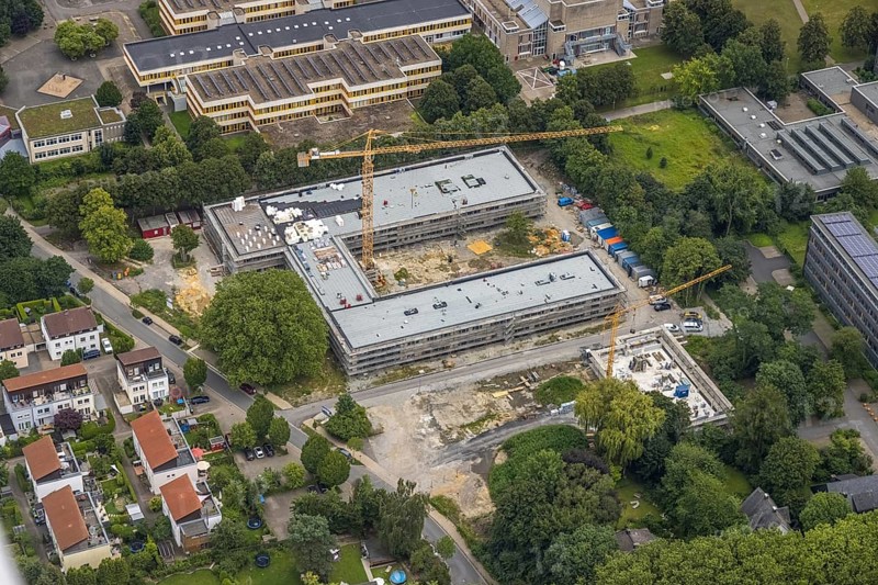 Aerial view, construction site and new building Bildungscampus Unna, new building kindergarten Rasselbande II Döbelner Straße, Königsborn, Unna, Ruhr area, North Rhine-Westphalia, Germany, construction work, construction area, construction site, building plots, construction crane, construction measure, construction project, construction site, education, campus, DE, Europe, kindergarten, day-care centre, day-care centre, day-care centre, aerial view, aerial photography, aerial photography, new building, overview, bird's-eye view, formerly Anne-Frank-Realschule, overview