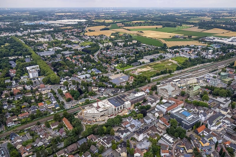 Aerial view, construction site and new shopping centre, former Bremme mill site, Unna railway station, town hall, Catholic Church St. Katharina, construction area Viktoriastraße for office building, Unna, Ruhr area, North Rhine-Westphalia, Germany, place of worship, railway tracks, railway station, construction work, construction area, construction site, building plots, construction project, construction site, authority, DE, Deutsche Bahn AG, shopping centre, Europe, religious community, place of worship, central station, main station, holy place, Kantstraße, church, parish, denomination, junction station, aerial view, aerial photography, aerial photography, new building, post office steps, religion, religious place, city administration, overview, bird's-eye view, birds-eyes view, overview