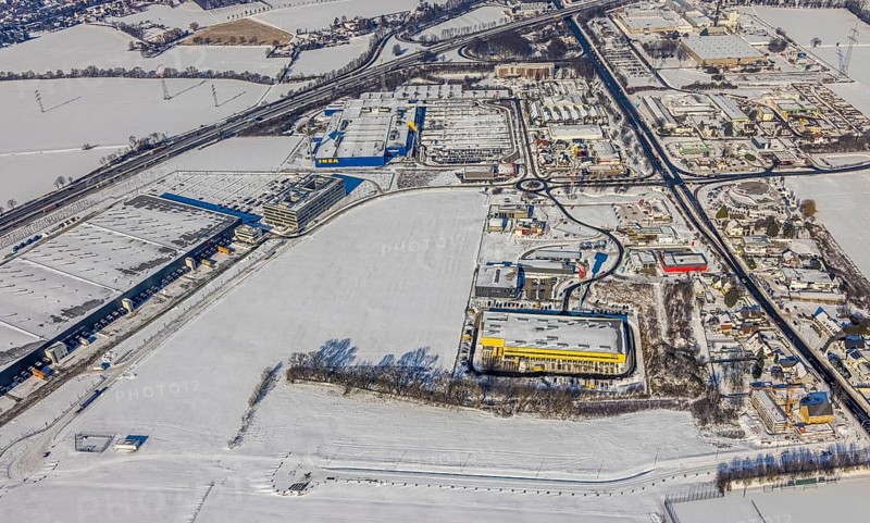 Aerial view, commercial area Unna-Kamen, central warehouse for Woolworth, ERL euro retail logistics GmbH, DHL, Ikea, Afferde, Unna, Ruhr area, North Rhine-Westphalia, Germany, DE, Europe, commercial enterprises, commercial area, commercial area, commercial location, commercial use, industrial area, industrial location, aerial view, aerial photography, aerial photography, Mönninghoffsfeld, snow, overview, bird's-eye view, winter, onset of winter, winter landscape, birds-eyes view, overview