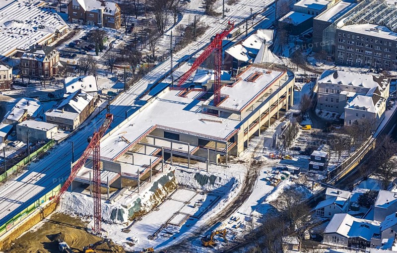 Aerial view, construction site new building shopping centre, former site Mühle Bremme, Unna, Ruhr area, North Rhine-Westphalia, Germany, construction work, construction area, construction site, building plots, construction measure, construction project, construction site, DE, shopping centre, Europe, Kantstraße, aerial view, aerial photography, aerial photography, new building, postal stairs, snow, overview, bird's eye view, winter, onset of winter, winter landscape, birds-eyes view, overview