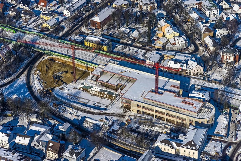 Aerial view, construction site new building shopping centre, former site Mühle Bremme, Unna, Ruhr area, North Rhine-Westphalia, Germany, construction work, construction area, construction site, building plots, construction measure, construction project, construction site, DE, shopping centre, Europe, Kantstraße, aerial view, aerial photography, aerial photography, new building, postal stairs, snow, overview, bird's eye view, winter, onset of winter, winter landscape, birds-eyes view, overview