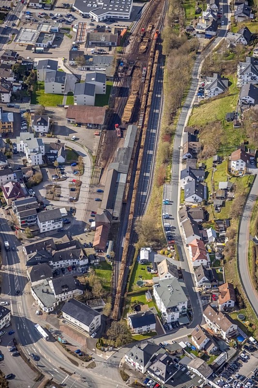 Aerial view, timber transport and loading at Sundern station, Sundern, Sauerland, North Rhine-Westphalia, Germany, railway tracks, railway station, DE, Deutsche Bahn AG, Europe, freight, freight transport, freight traffic, main station, aerial view, aerial photography, aerial photography, overview, bird's-eye view, overview