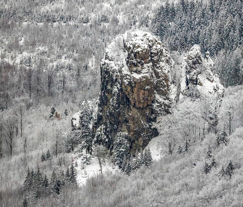 Aerial view of the rock formation Bruchhauser Steine a ground monument with four main rocks on the Istenberg in the Rothaargebirge in winter with snow in Bruchhausen in Olsberg in Sauerland in North Rhine-Westphalia, Germany, Sauerland, Europe, aerial view, birds-eyes view, aerial photography, aerial photography, overview, bird's eye view