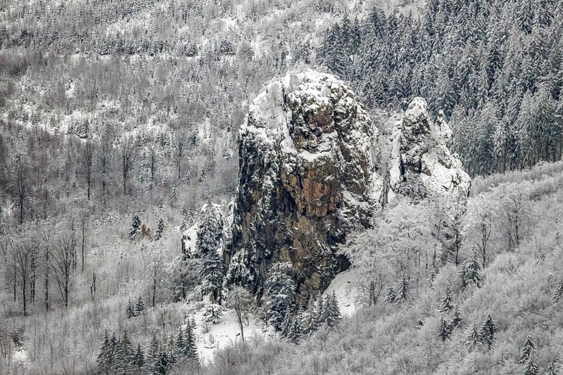 Aerial view of the rock formation Bruchhauser Steine a ground monument with four main rocks on the Istenberg in the Rothaargebirge in winter with snow in Bruchhausen in Olsberg in Sauerland in North Rhine-Westphalia, Germany, Sauerland, Europe, aerial view, birds-eyes view, aerial photography, aerial photography, overview, bird's eye view