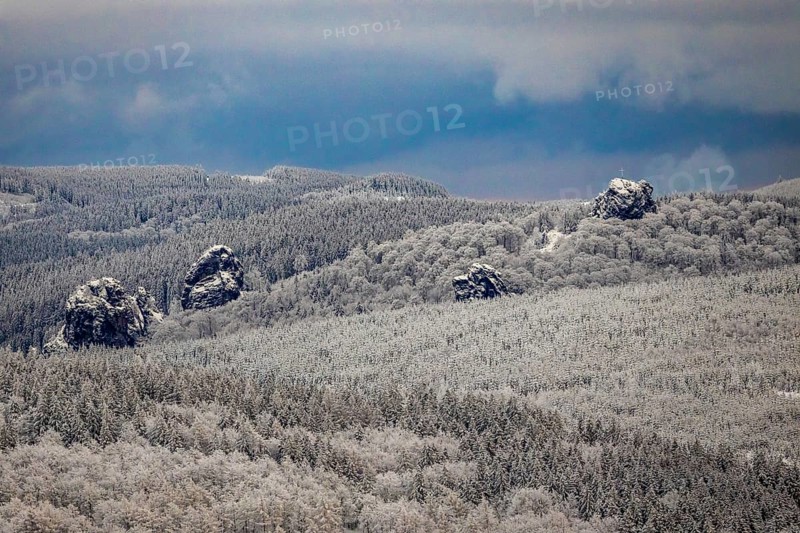 Aerial view of the rock formation Bruchhauser Steine a ground monument with four main rocks on the Istenberg in the Rothaargebirge in winter with snow in Bruchhausen in Olsberg in Sauerland in North Rhine-Westphalia, Germany, Sauerland, Europe, aerial view, birds-eyes view, aerial photography, aerial photography, overview, bird's eye view