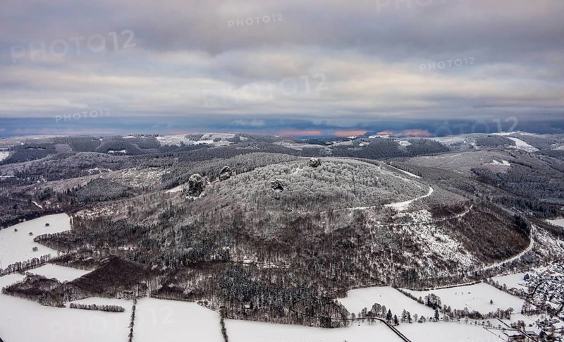 Aerial view of the rock formation Bruchhauser Steine a ground monument with four main rocks on the Istenberg in the Rothaargebirge in winter with snow in Bruchhausen in Olsberg in Sauerland in North Rhine-Westphalia, Germany, Sauerland, Europe, aerial view, birds-eyes view, aerial photography, aerial photography, overview, bird's eye view