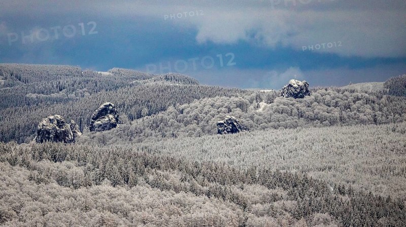 Aerial view of the rock formation Bruchhauser Steine a ground monument with four main rocks on the Istenberg in the Rothaargebirge in winter with snow in Bruchhausen in Olsberg in Sauerland in North Rhine-Westphalia, Germany, Sauerland, Europe, aerial view, birds-eyes view, aerial photography, aerial photography, overview, bird's eye view