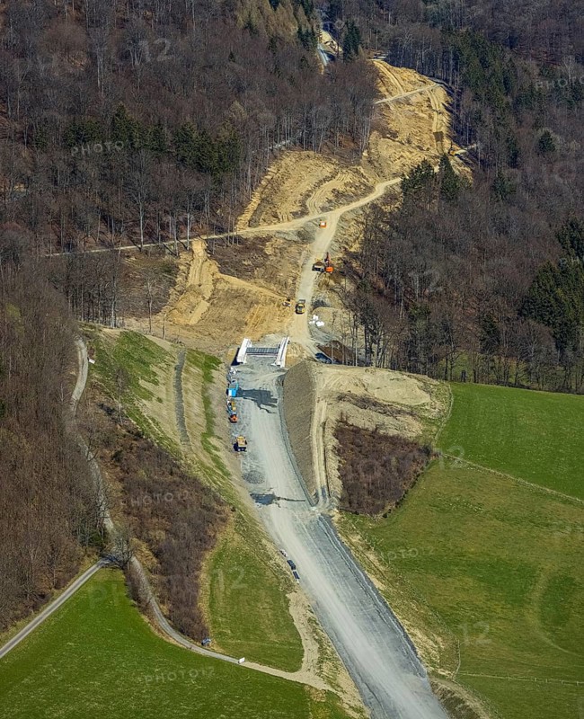 Aerial view, construction site and new construction of the L776n bypass Bad Fredeburg, Fredeburg, Schmallenberg, Sauerland, North Rhine-Westphalia, Germany, construction work, construction, construction area, building site, building plots, construction measure, construction project, construction site, bridge, DE, relief of the through road, Europe, property tax, real estate, state road L776n, aerial view, aerial photography, aerial photography, new construction, bypass, overview, bypass road, bird's eye view, forest area, residential area, housing and living, residential area, residential buildings, quality of living, birds-eyes view, overview