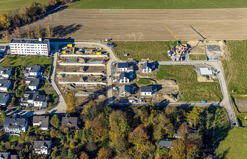 Aerial view, construction site and new construction of residential buildings on Breslauer Straße in Schmallenberg, Sauerland, North Rhine-Westphalia, Germany, construction work, construction area, building plots, construction project, construction site, DE, Europe, property tax, real estate, aerial view, aerial photography, aerial photography, new construction, Schmallenberg, overview, bird's eye view, residential complex, living and living, residential area, residential buildings, residential quality, residential neighbourhood, housing estate, birds-eyes view, overview, retaining walls