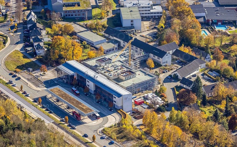 Aerial view, bus station and construction work at the vocational college Olsberg of the HSK in Olsberg, Sauerland, North Rhine-Westphalia, Germany, construction work, construction project, construction site, vocational college, vocational school, education, educational institution, bus station, bus stop, DE, Europe, educational institute, aerial view, aerial photography, aerial photography, Olsberg, bus station, school, overview, bird's eye view, ZOB, birds-eyes view, overview