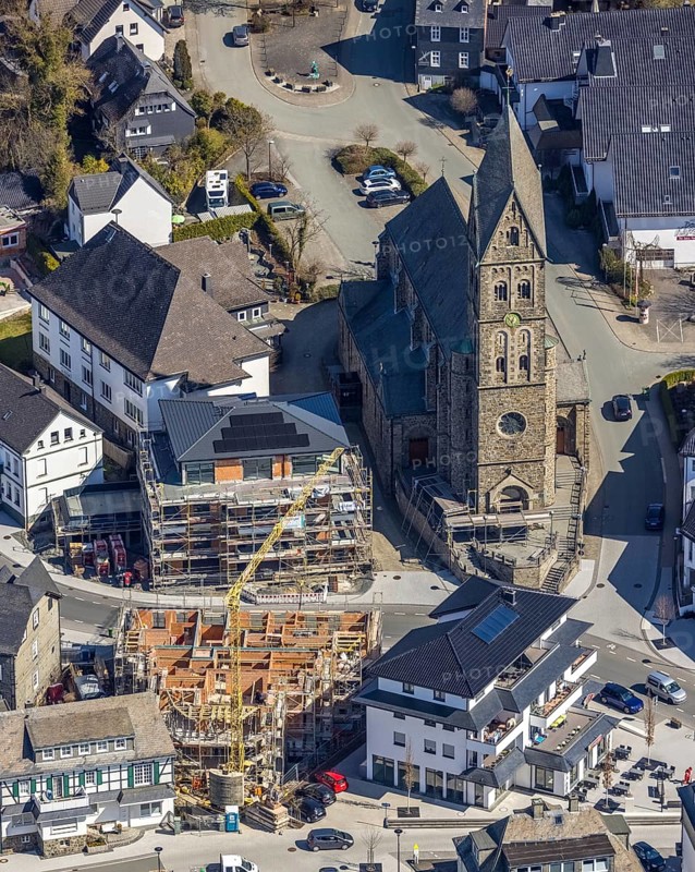 Aerial view, Construction site, New residential and commercial building Bahnhofstraße at the catholic parish church St. Nikolaus, Olsberg, Sauerland, North Rhine-Westphalia, Germany, place of worship, construction work, construction area, construction site, construction measure, construction project, construction site, DE, Europe, religious community, place of worship, property tax, real estate, capacity requirement, church, parish, denomination, aerial view, aerial photography, aerial photography, parish church, religion, overview, bird's eye view, living and working, living and life, residential area, birds-eyes view, overview