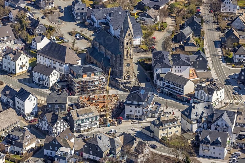 Aerial view, Construction site, New residential and commercial building Bahnhofstraße at the catholic parish church St. Nikolaus, Olsberg, Sauerland, North Rhine-Westphalia, Germany, place of worship, construction work, construction area, construction site, construction measure, construction project, construction site, DE, Europe, religious community, place of worship, property tax, real estate, capacity requirement, church, parish, denomination, aerial view, aerial photography, aerial photography, parish church, religion, overview, bird's eye view, living and working, living and life, residential area, birds-eyes view, overview