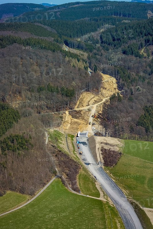 Aerial view, construction site and new construction of the L776n bypass Bad Fredeburg, Fredeburg, Schmallenberg, Sauerland, North Rhine-Westphalia, Germany, construction work, construction, construction area, construction site, building plots, construction project, construction site, bridge, DE, relief of the through road, Europe, state road L776n, aerial view, aerial photography, aerial photography, new construction, bypass, overview, bypass road, bird's-eye view, forest area, residential area, birds-eyes view, overview