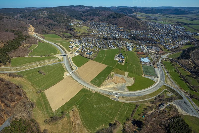 Aerial view, construction site and new construction of the L776n bypass Bad Fredeburg, Fredeburg, Schmallenberg, Sauerland, North Rhine-Westphalia, Germany, construction work, construction, construction area, building site, building plots, construction measure, construction project, construction site, bridge, DE, relief of the through road, Europe, property tax, real estate, state road L776n, aerial view, aerial photography, aerial photography, new construction, bypass, overview, bypass road, bird's eye view, forest area, residential area, housing and living, residential area, residential buildings, quality of living, birds-eyes view, overview