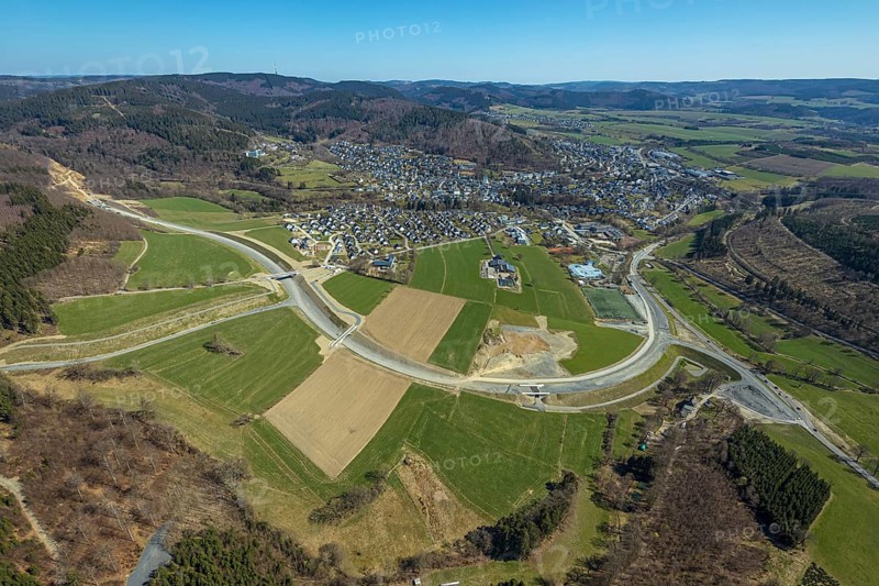 Aerial view, construction site and new construction of the L776n bypass Bad Fredeburg, Fredeburg, Schmallenberg, Sauerland, North Rhine-Westphalia, Germany, construction work, construction, construction area, building site, building plots, construction measure, construction project, construction site, bridge, DE, relief of the through road, Europe, property tax, real estate, state road L776n, aerial view, aerial photography, aerial photography, new construction, bypass, overview, bypass road, bird's eye view, forest area, residential area, housing and living, residential area, residential buildings, quality of living, birds-eyes view, overview