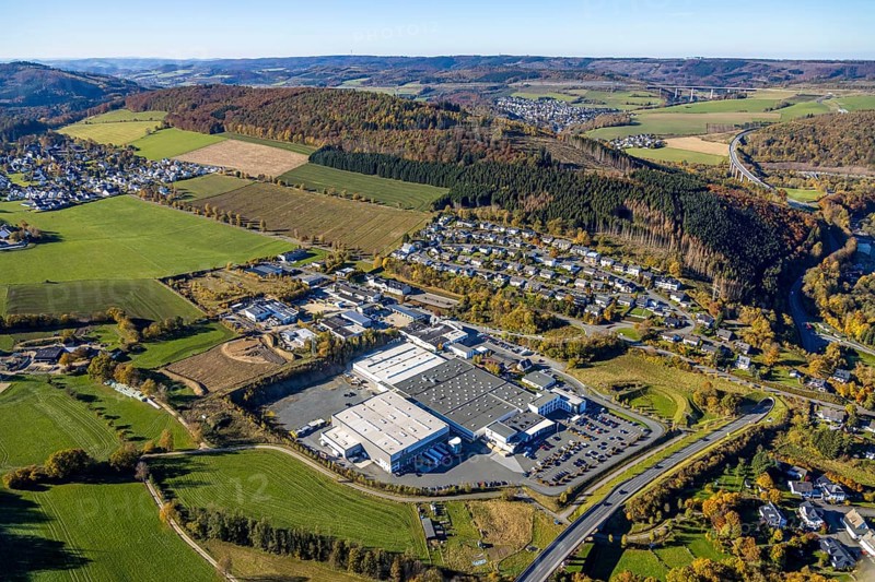 Aerial view, construction area in the industrial estate Zum Hohlen Morgen in the district of Bigge in Olsberg, Sauerland, North Rhine-Westphalia, Germany, construction area, construction site, building plots, DE, Europe, commercial enterprises, commercial area, commercial park, commercial site, commercial use, industrial area, industrial site, aerial photograph, aerial photography, aerial photography, Olsberg, overview, bird's eye view, birds-eyes view, overview
