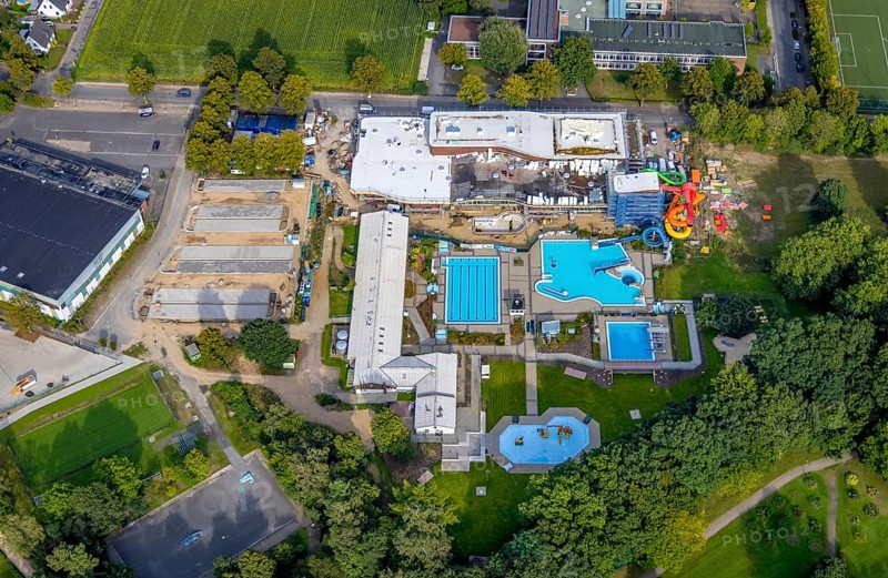 Aerial view, construction site and new construction of an indoor swimming pool at the Rheine outdoor swimming pool in Rheine-Stadt in Rheine, Münsterland, North Rhine-Westphalia, Germany, bathing establishment, bathing resort, construction work, construction area, construction site, building site, construction project, construction site, DE, Europe, outdoor swimming pool, indoor swimming pool, aerial view, aerial photography, aerial photography, new construction, Rheine, swimming pool, overview, bird's eye view, overview