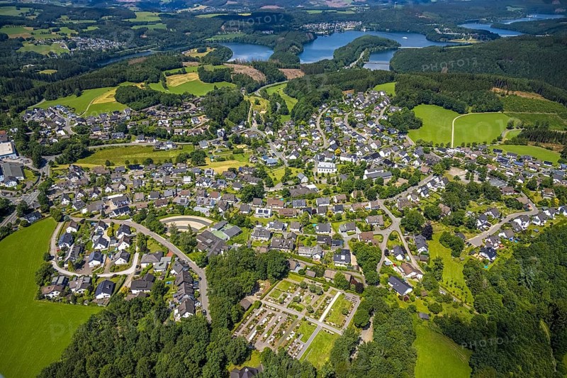 Aerial view, local view Rhode, catholic primary school Franz-Hitze-Schule, church St. Cyriakus, Olpe, Sauerland, North Rhine-Westphalia, Germany, place of worship, burial site, Biggesee, education, educational institution, DE, Europe, cemetery, memorial, religious community, churchyard, place of worship, primary school, land tax, graves, burial ground, sacred site, hilly landscape, real estate, church, parish, denomination, educational institute, aerial view, aerial photography, aerial photography, local view, religion, religious site, resting place, school, townscape, urban area, overview, bird's-eye view, housing estate, housing and living, residential area, residential buildings, housing quality, housing estate, birds-eyes view, overview