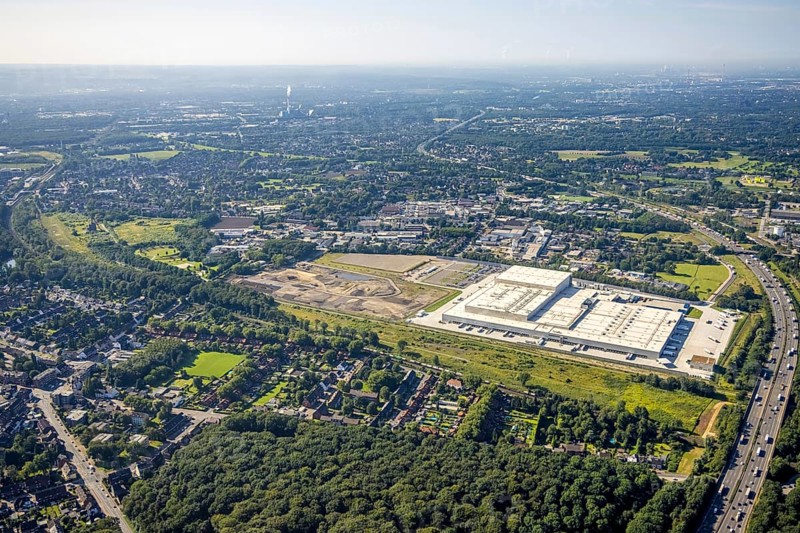 Aerial view, Edeka central warehouse Oberhausen with fallow land and Sterkrade colliery in the district of Schwarze Heide in Oberhausen, Ruhr area, North Rhine-Westphalia, Germany, construction area, building site, building plots, DE, Europe, commercial enterprises, commercial area, commercial park, commercial location, commercial use, freight traffic, industrial area, industrial building, industrial site, logistics, logistics service, logistics service provider, logistics provider, logistics centre, aerial view, aerial photography, aerial photography, Oberhausen, transport service, overview, bird's eye view, colliery, birds-eyes view, overview
