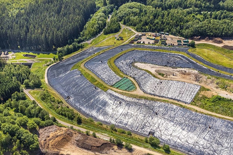 Aerial view, Landfill Olper Entsorgungszentrum GmbH, Oberveischede Unterneger, Oberveischede, Olpe, Sauerland, North Rhine-Westphalia, Germany, waste, bark beetle plague, DE, landfill* Germany, drought, Europe, spruce dieback, aerial photograph, aerial view, dump, hilly landscape, compost, composting plant Olpe, storage, aerial view, aerial photography, aerial photograph, aerial photography, waste, Neuenwald, recycling, recycling centre, collection point, drought, overview, sealing, recycling, bird's-eye view, forest damage, forest damage, lack of water, birds-eyes view, overview