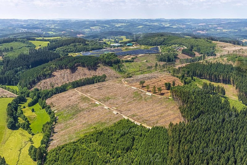 Aerial view, forest area with forest damage and clear cutting, area covered with plastic tarpaulins of the landfill Olper Entsorgungszentrum GmbH, Oberveischede Unterneger, Oberveischede, Olpe, Sauerland, North Rhine-Westphalia, Germany, waste, tree mortality, tree trunks, bark beetle plague, DE, landfill* Germany, drought, Europe, spruce mortality, aerial photograph, aerial view, aerial photography, aerial dump, hilly landscape, clear-cut, clear-cutting, compost, composting plant Olpe, storage, aerial photograph, aerial photography, aerial photography, aerial photography, waste, Neuenwald, recycling, recycling centre, collection point, drought, overview, sealing, recycling, bird's-eye view, forest, forest area, forest damage, forest damage, forest dieback, water shortage, birds-eyes view, overview