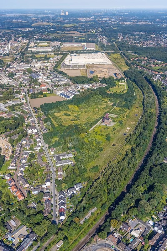 Aerial view, Sterkrade colliery with historic winding tower, Edeka central warehouse and SEGRO Logistics Park in the Schwarze Heide district of Oberhausen, Ruhr area, North Rhine-Westphalia, Germany, DE, Europe, commercial enterprises, commercial area, commercial park, Waldteich commercial park, commercial location, commercial use, freight traffic, industrial area, industrial building, industrial location, logistics, logistics service, logistics service provider, logistics provider, logistics centre, aerial view, aerial photography, aerial photography, Oberhausen, SEGRO Parks, transport service, overview, bird's eye view, colliery, birds-eyes view, overview