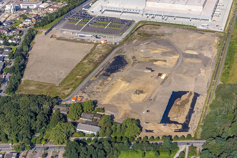 Aerial view, Edeka central warehouse Oberhausen with fallow land in the industrial park Waldteich in the district Schwarze Heide in Oberhausen, Ruhr area, North Rhine-Westphalia, Germany, motorway A3, construction area, building site, building plots, DE, Europe, commercial enterprises, commercial area, industrial park, commercial location, commercial use, freight traffic, industrial area, industrial building, industrial site, logistics, logistics service, logistics service provider, logistics provider, logistics centre, aerial view, aerial photography, aerial photography, Oberhausen, transport service, overview, bird's-eye view, overview