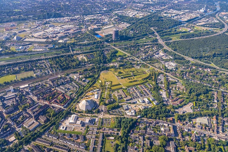 Aerial view, OLGA Park with ASO Oberhausen senior citizens' residence at OLGA Park, winding tower and old Steigerhaus as well as garden dome, in the background the Centro Oberhausen shopping centre in Osterfeld in Oberhausen, Ruhr area, North Rhine-Westphalia, Germany, DE, shopping centre, shopping mall, shopping mile, shopping markets, shopping place, shopping centre, Europe, leisure park, culture, art, aerial view, aerial photography, aerial photography, Oberhausen, park, shopping, shopping centre, overview, event location, event venue, event centre, bird's-eye view, birds-eyes view, former Osterfeld colliery and coking plant, cultural use, overview