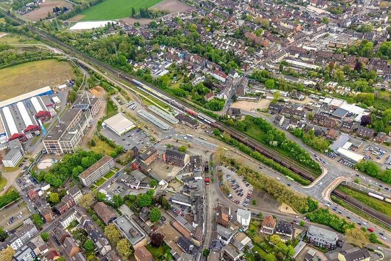 Aerial view, railway station and bus station, biomass cogeneration plant of Energieversorgung Oberhausen AG, Sterkrade Mitte, Oberhausen, Ruhr area, North Rhine-Westphalia, Germany, railway tracks, railway station, bus stop, DE, Deutsche Bahn AG, Europe, main station, power station, aerial view, aerial photography, aerial photography, overview, bird's eye view, ZOB, birds-eyes view, overview
