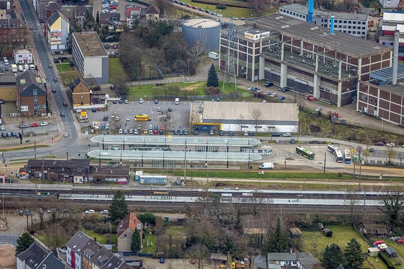Aerial view, railway station and bus station, biomass cogeneration plant of Energieversorgung Oberhausen AG, Sterkrade Mitte, Oberhausen, Ruhr area, North Rhine-Westphalia, Germany, railway tracks, railway station, bus stop, DE, Deutsche Bahn AG, Europe, main station, power station, aerial view, aerial photography, aerial photography, overview, bird's eye view, ZOB, birds-eyes view, overview