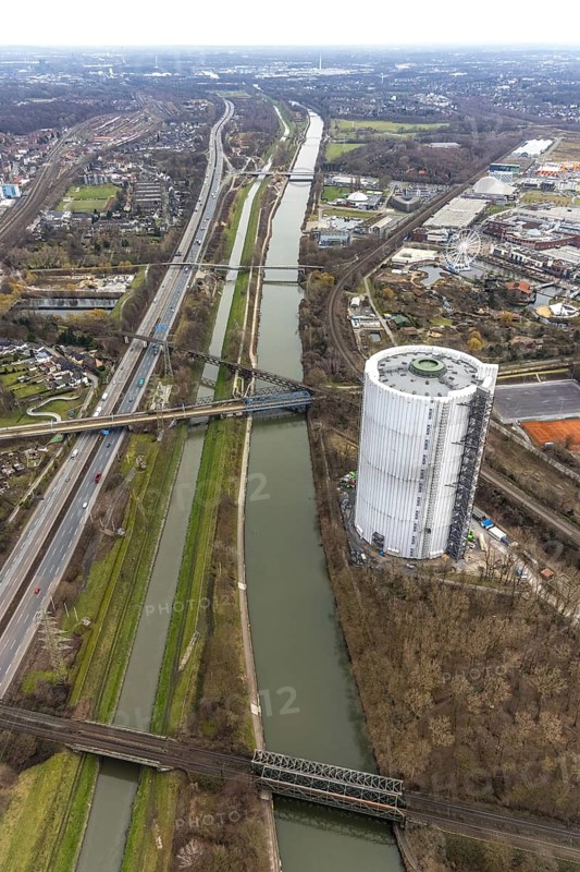 Aerial view, gasometer renovation measures, covered gasometer at CentrO, Rhine-Herne Canal. River Emscher, Borbeck, Oberhausen, Ruhr area, North Rhine-Westphalia, Germany, DE, Europe, industrial monument, culture, art, aerial view, aerial photography, aerial photography, overview, events, venue, event location, event centre, bird's eye view, birds-eyes view, cultural use, overview