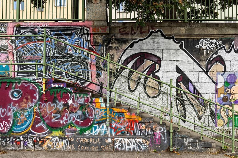 Diverse graffiti with lettering on a concrete wall next to a staircase, Am Donaukanal Innere Stadt Vienna Austria