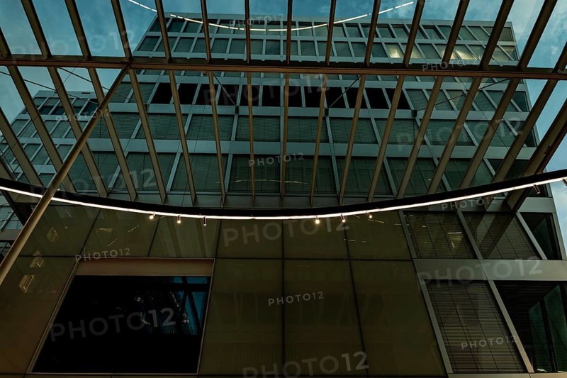 Modern Illuminated Office Building to Zurich Airport at Night in the Airport in Kloten, Zurich, Zurich Canton, Switzerland